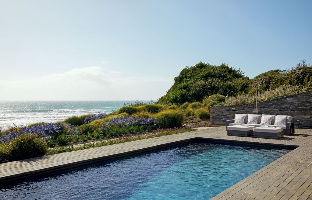 Image may contain Water Pool Outdoors Building Swimming Pool Hotel Nature and Resort