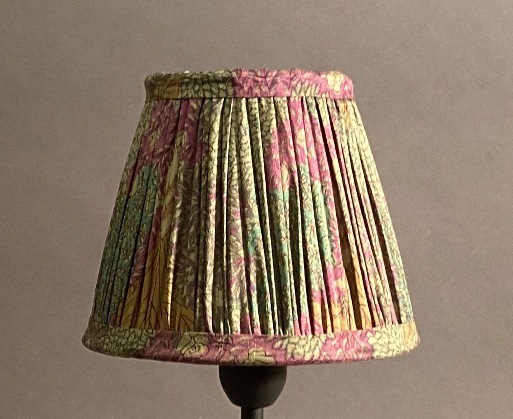 Image may contain Lamp Lampshade Skirt Clothing and Apparel
