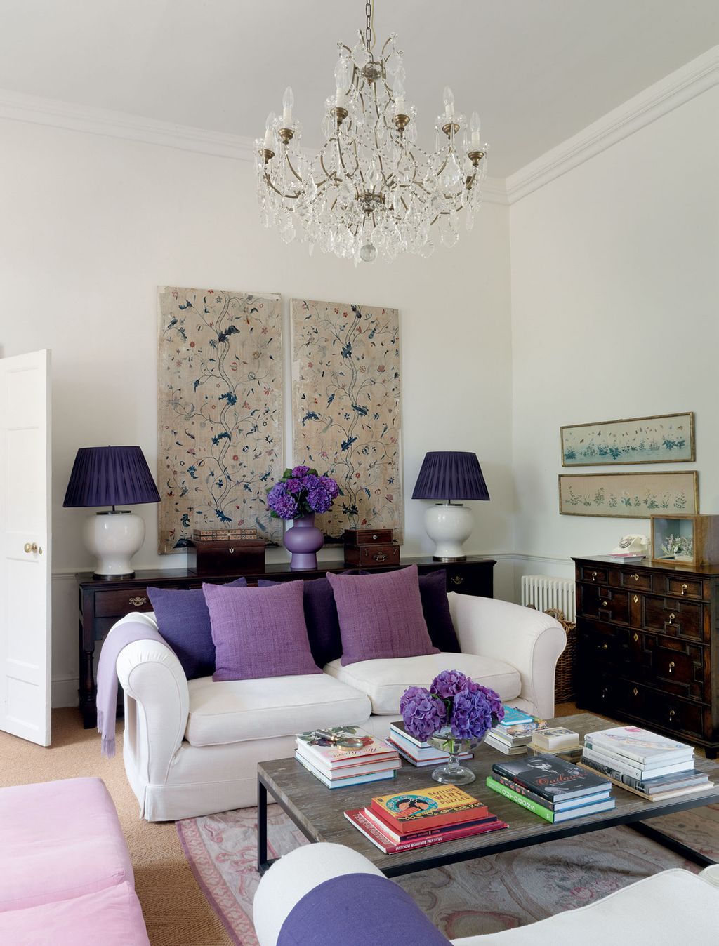 Image may contain Furniture Living Room Room Indoors Couch Book Table Lamp Chandelier Interior Design and Rug