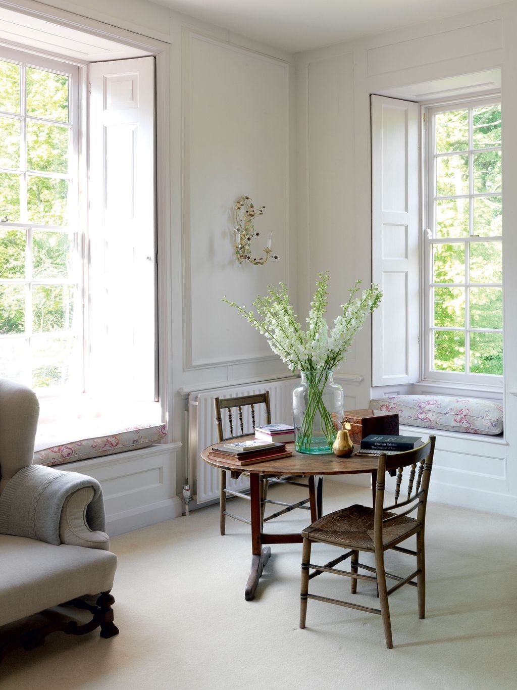 Image may contain Furniture Chair Living Room Room Indoors Table Coffee Table Interior Design and Dining Table