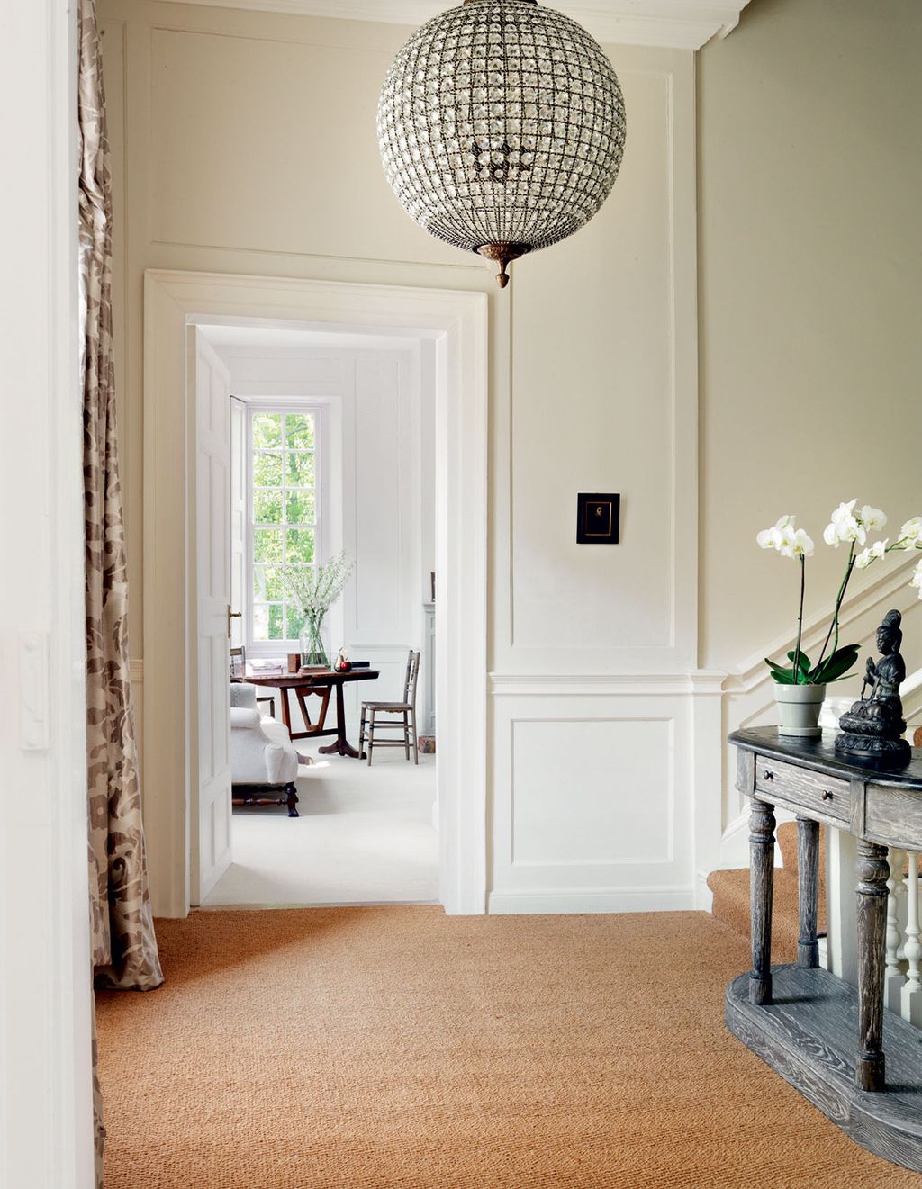 Image may contain Flooring Interior Design Indoors Floor Corner Wood Hardwood Living Room Room Furniture and Vase