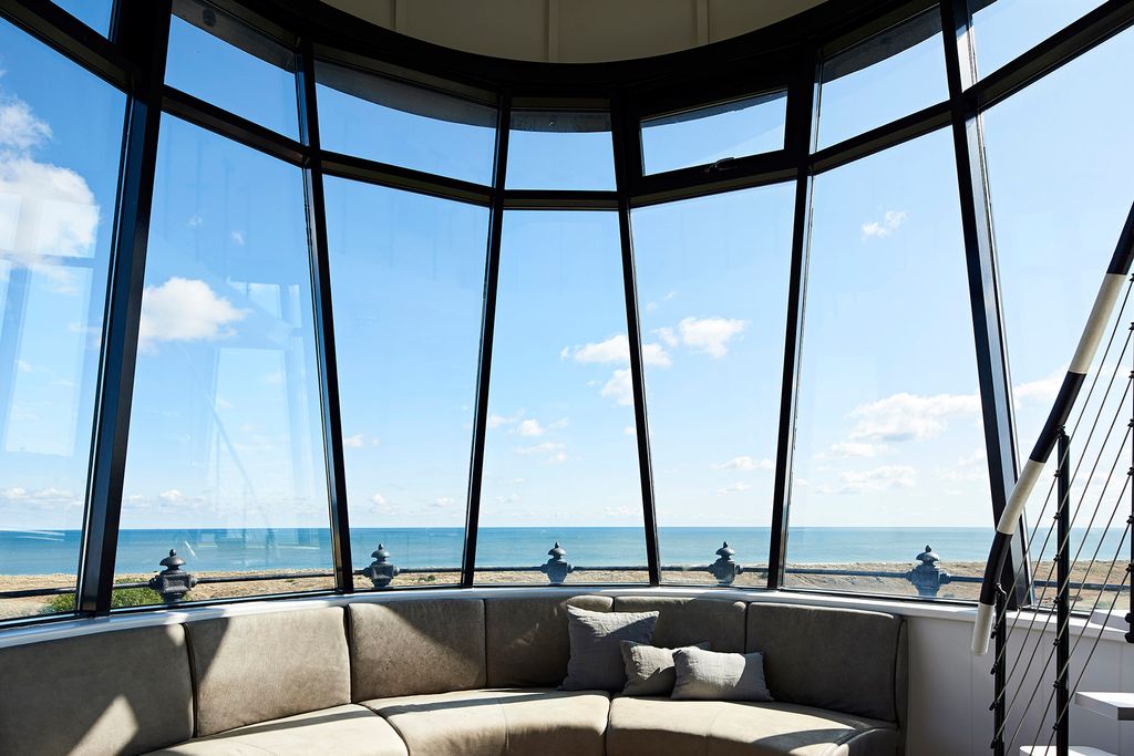 Image may contain Housing Building Furniture Couch Indoors Penthouse Table Living Room Room and Interior Design