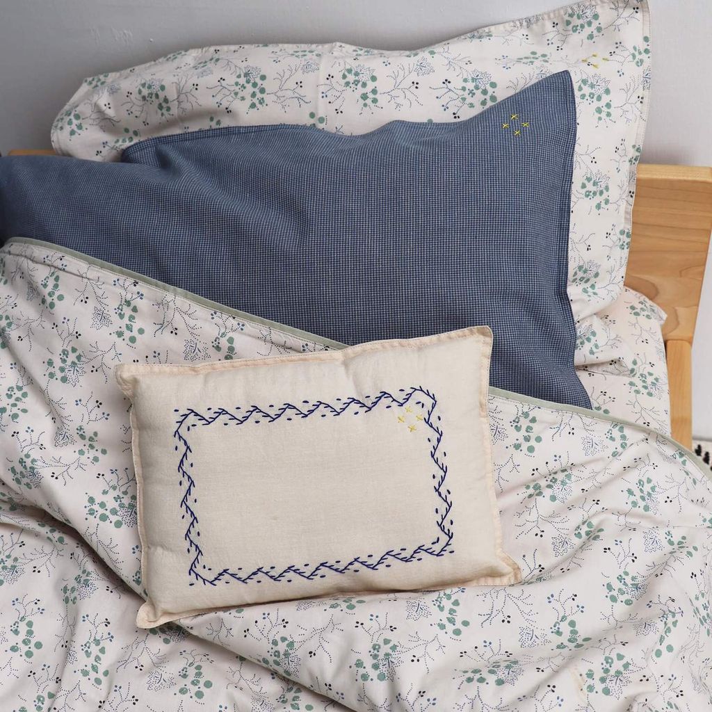 Image may contain Cushion Pillow Furniture and Diaper