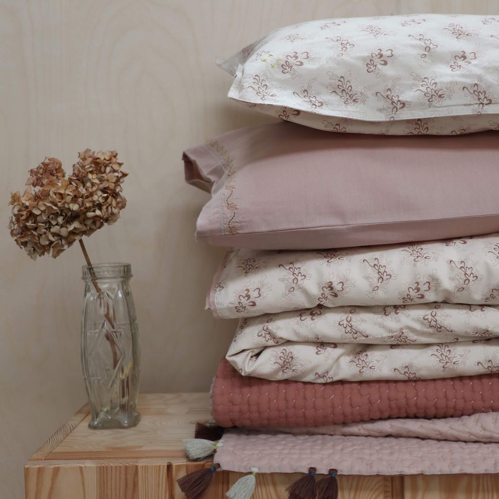 Image may contain Home Decor Linen Cushion Pillow and Blanket