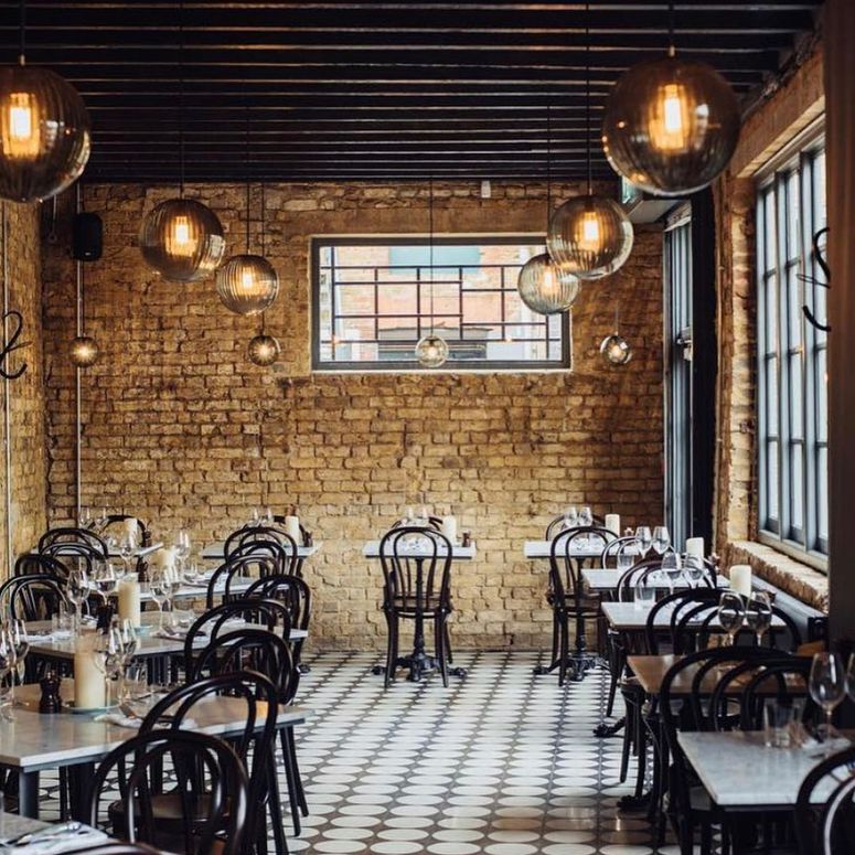 Image may contain: Restaurant, Furniture, Chair, Cafe, Cafeteria, Food, and Meal