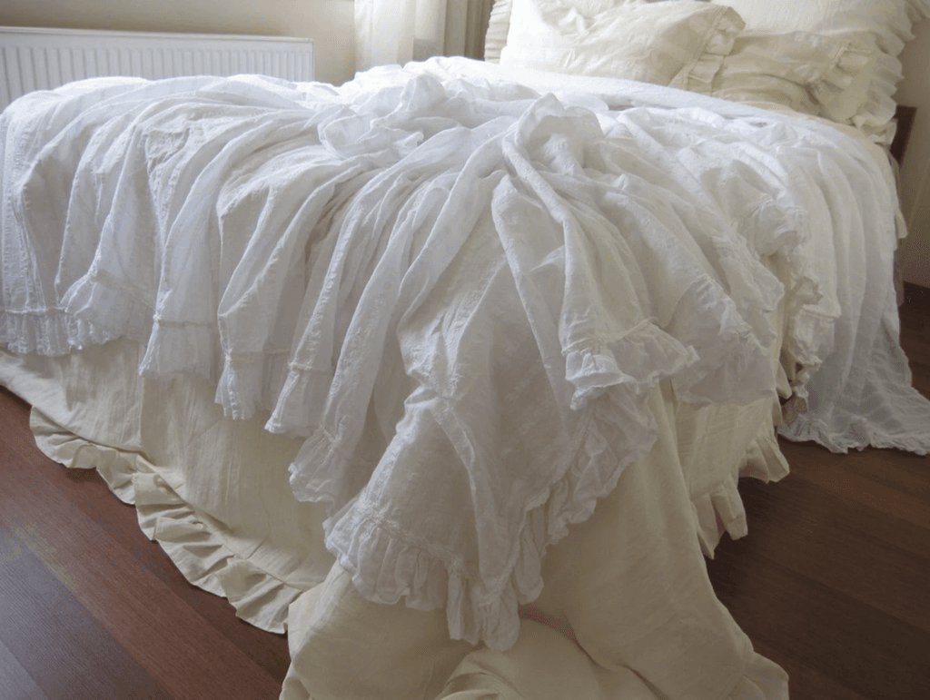 Image may contain Home Decor Linen Furniture Blanket and Bed