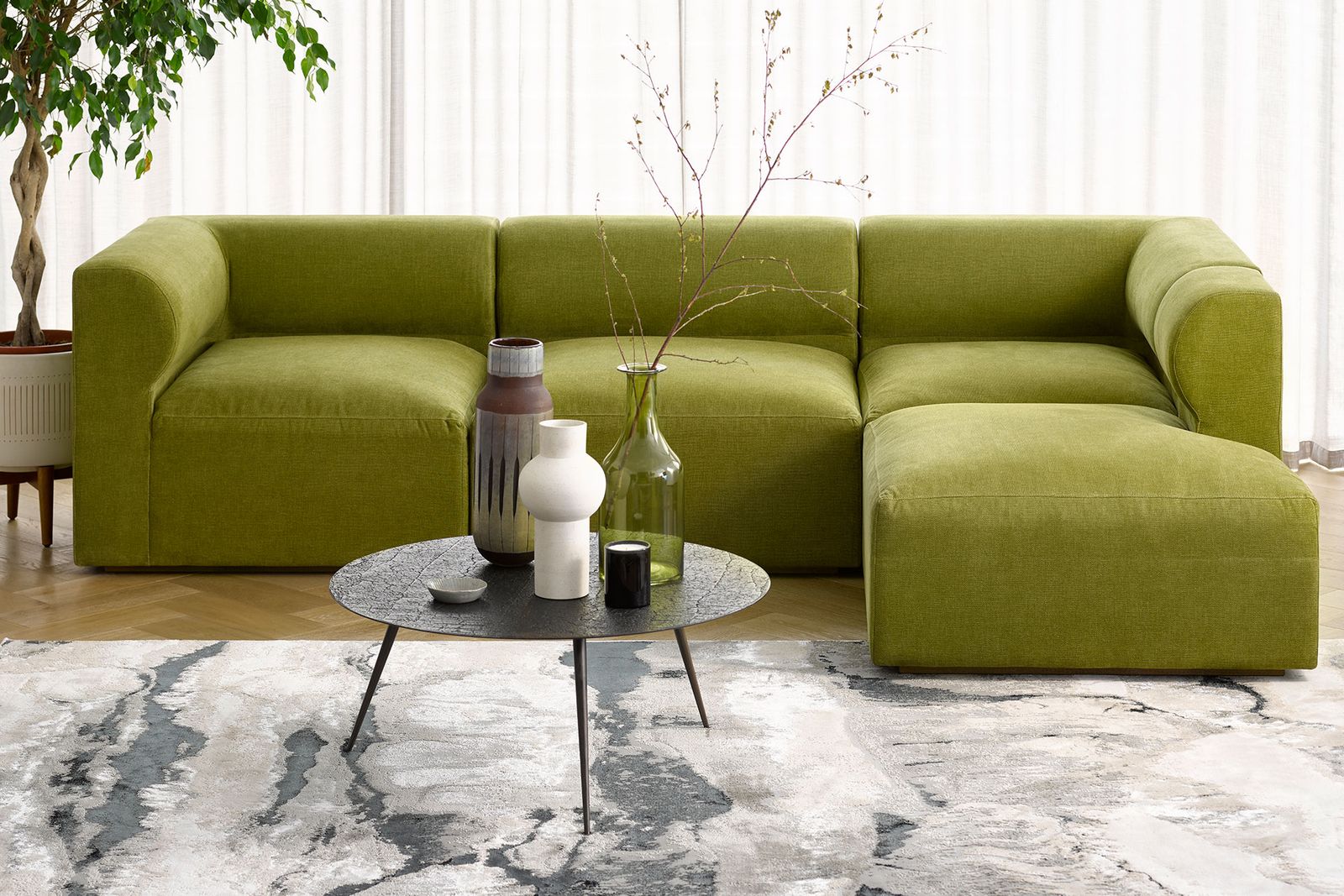 Image may contain Furniture Table Coffee Table Rug Room Indoors Living Room Flower Ikebana Ornament and Vase