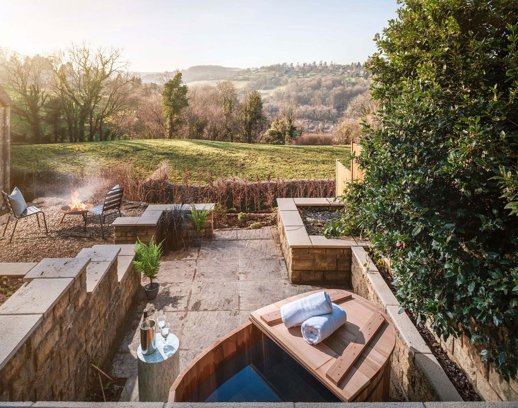 On the lower level a hot tub is the star of the show.