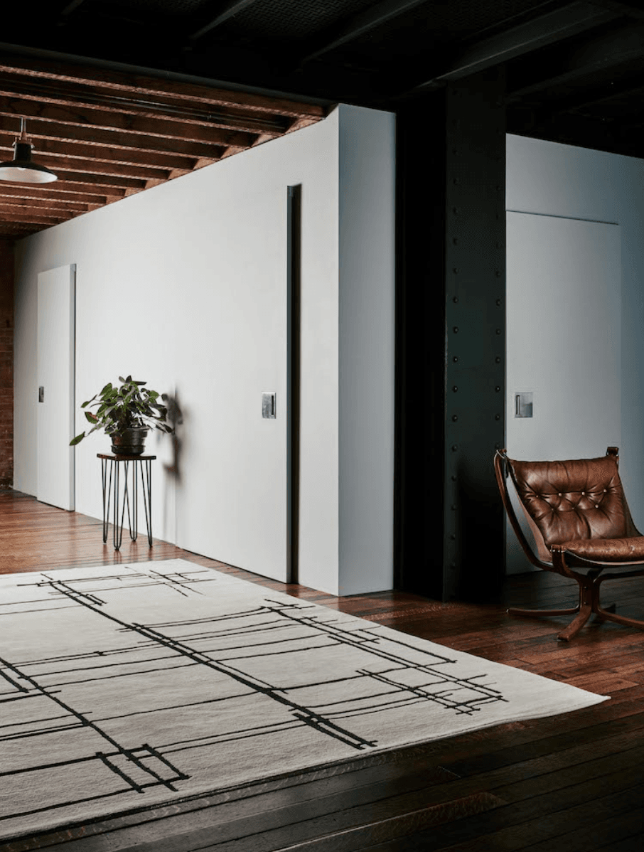 Image may contain Flooring Floor Rug Wood Hardwood Furniture Indoors and Interior Design