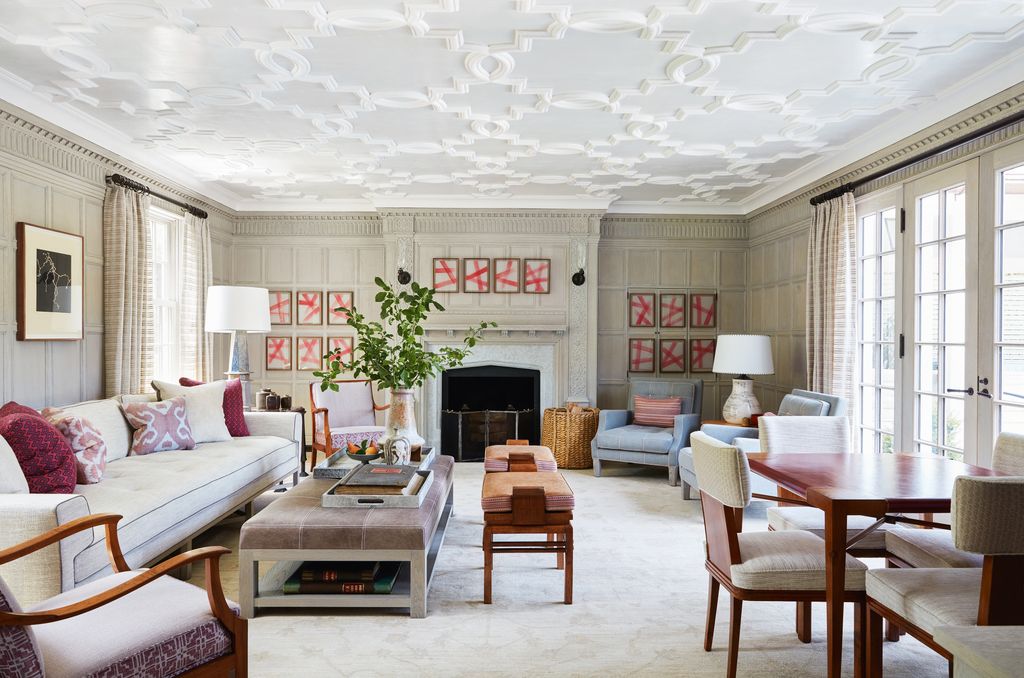 Image may contain Furniture Living Room Room Indoors Chair Table Interior Design Coffee Table Couch and Fireplace