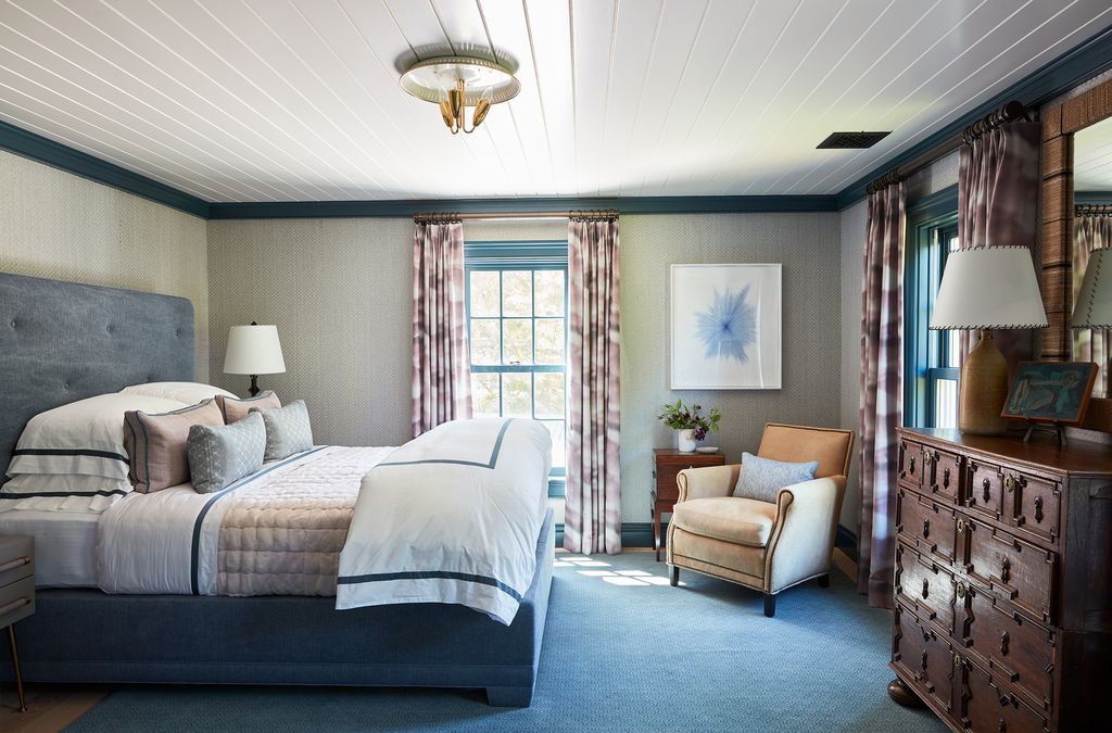 Curtains in ‘Clouds by Sahco frame the view in this bedroom. The artwork is by Idris Khan.