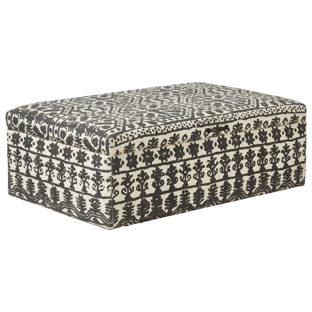 Image may contain Furniture Rug and Ottoman