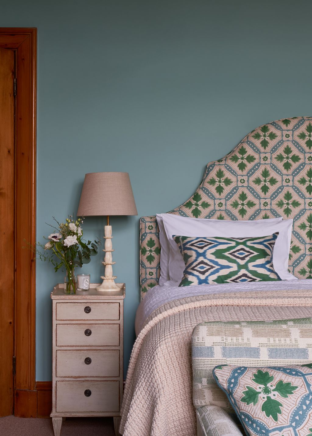 Image may contain Lamp Table Lamp Furniture Cushion Home Decor Indoors Room and Bedroom