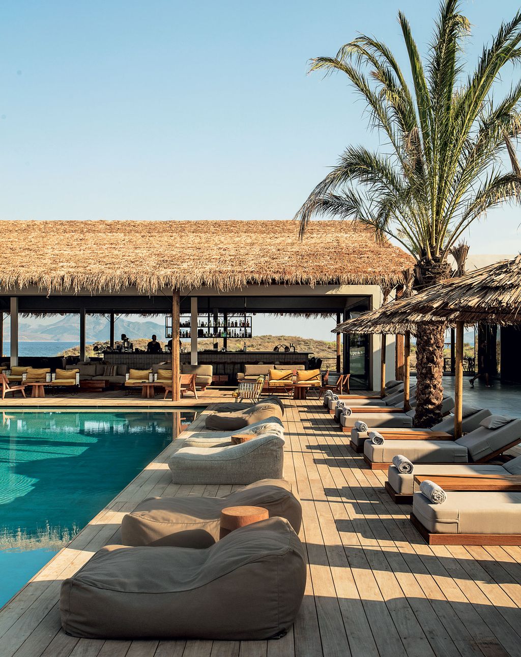 Image may contain Water Pool Human Person Resort Hotel Building Swimming Pool Outdoors Nature and Shelter