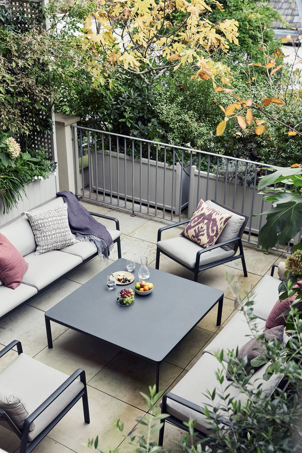 Even the most compact paved area can house a comfortable seating area as this space in a London house designed by Martin...
