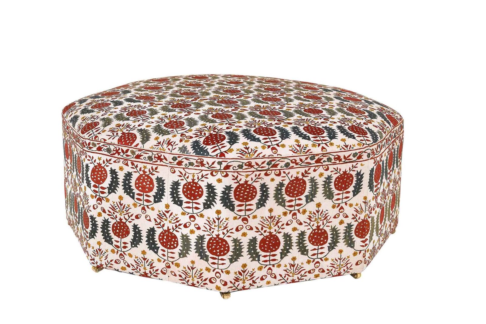 Image may contain Furniture Rug and Ottoman