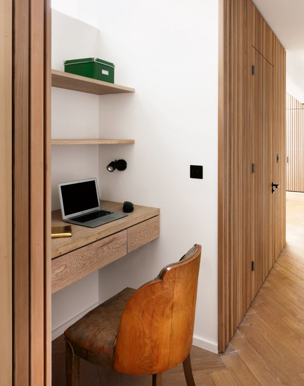A tiny space is neatly given over to a thoughtfully designed desk area in this house by De Rosee Sa. The builtin...