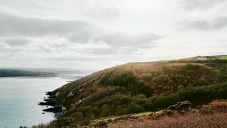 Image may contain Nature Outdoors Land Shoreline Water Ocean Sea Promontory Slope Coast and Peninsula