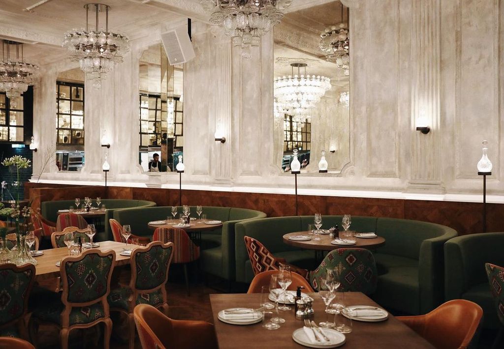 Image may contain Furniture Chair Restaurant Human Person Cafe Room and Indoors