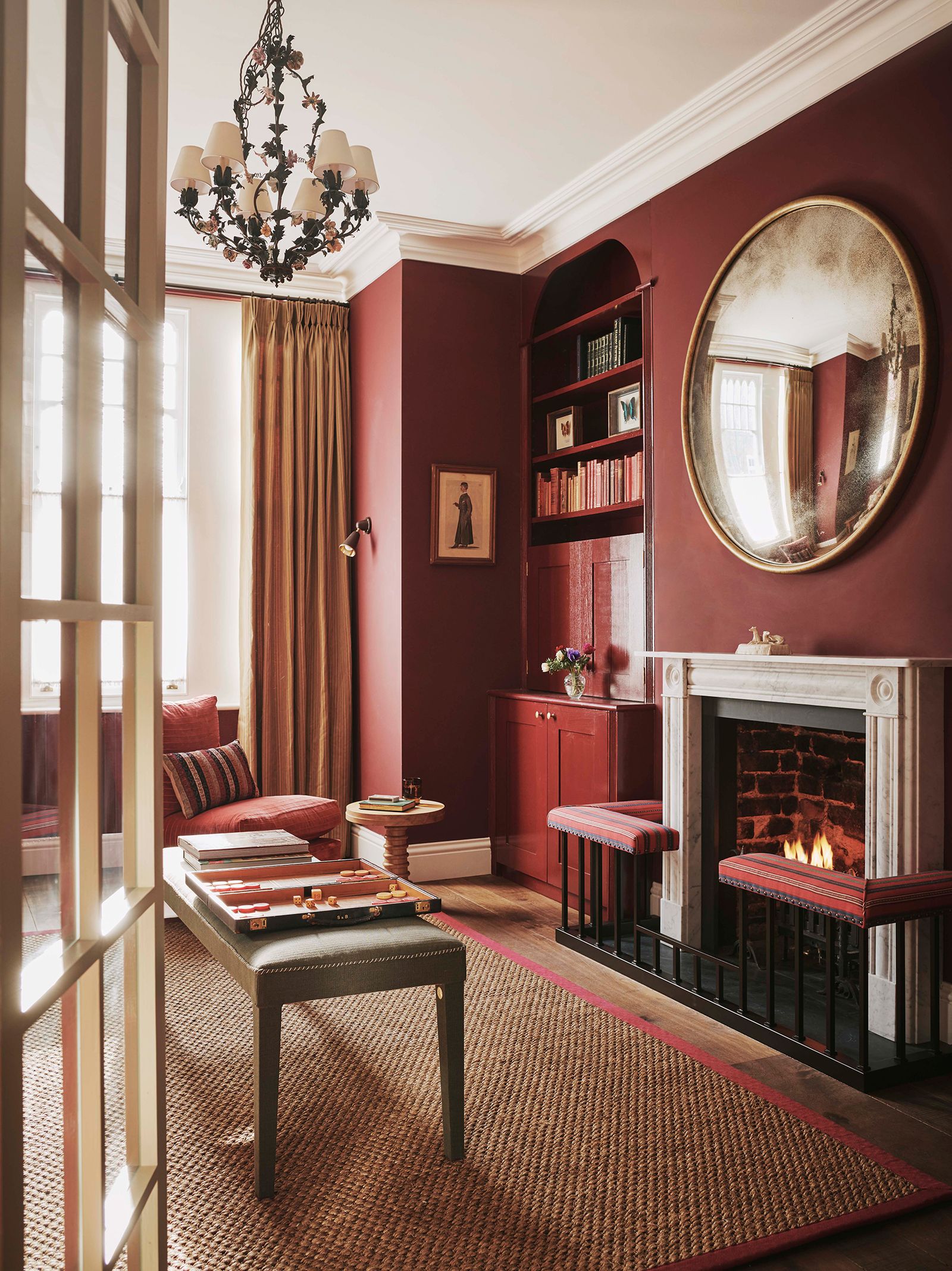 The sitting of this inviting London home is in ‘Murrey Red from Papers and Paints.