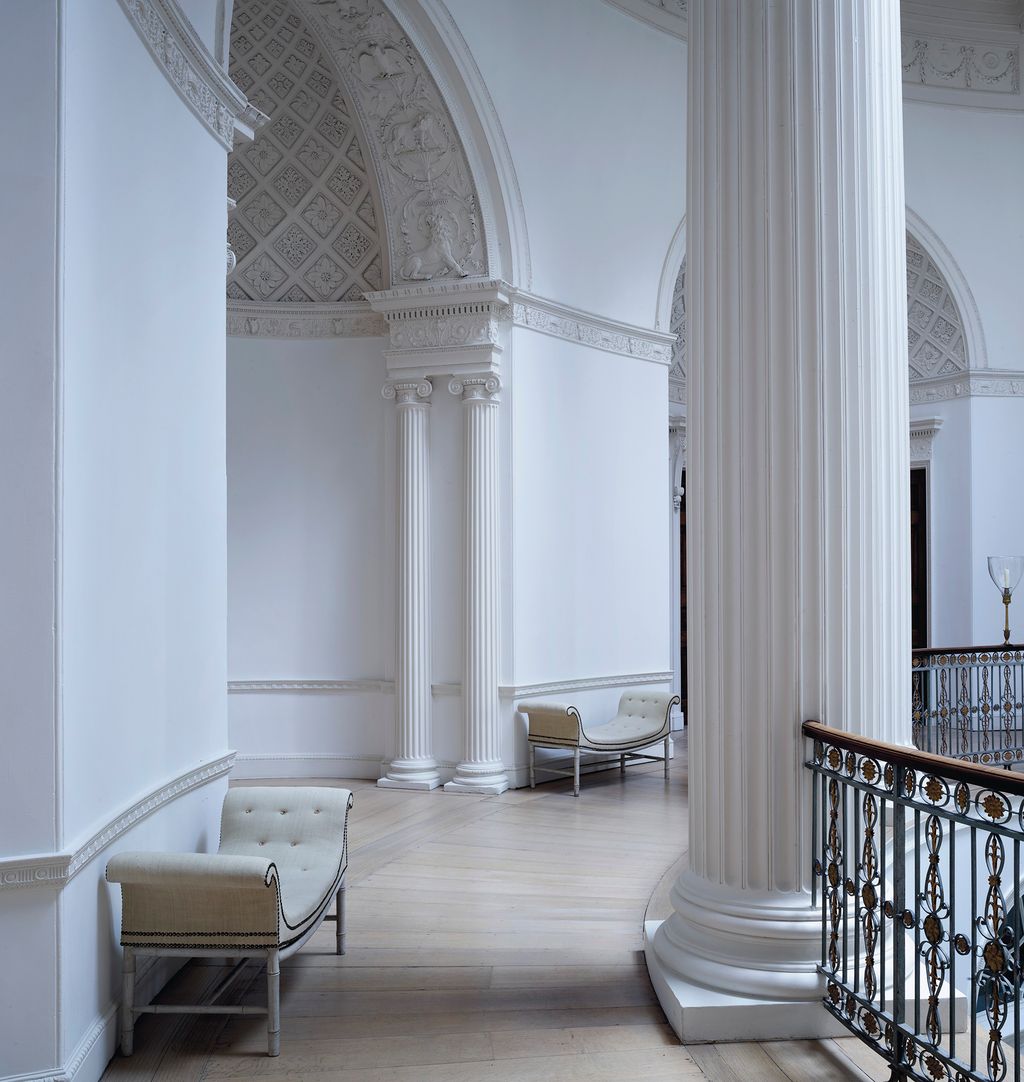 Image may contain Flooring Floor Banister Handrail Corridor Interior Design Indoors and Railing