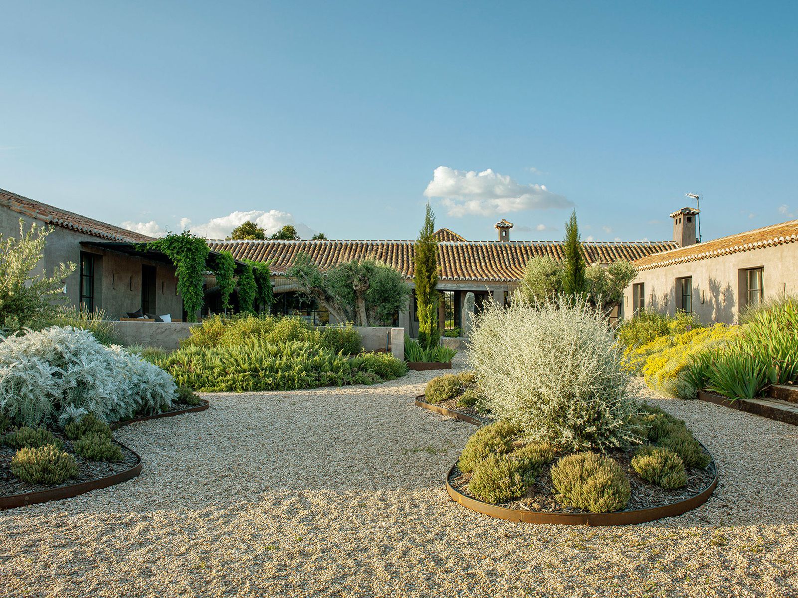 The two new wings added at the rear of the original cowshed enclose part of the garden created by the landscape...
