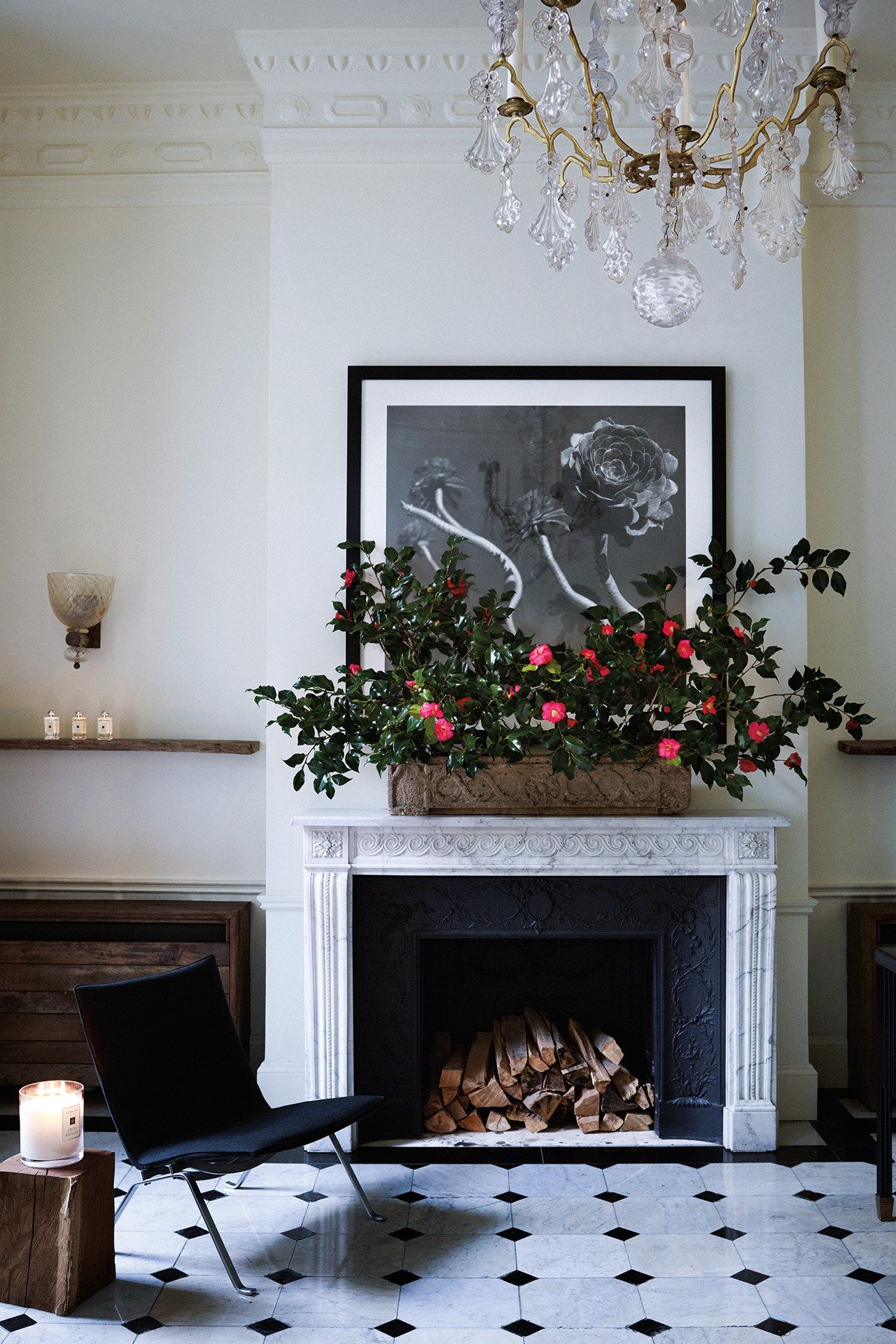 Image may contain Fireplace Indoors Furniture Chair Hearth Lamp Chandelier and Interior Design