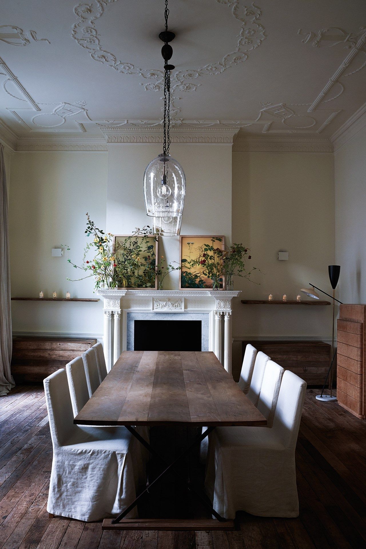 Image may contain Flooring Room Indoors Dining Room Hardwood Wood Furniture Chair Interior Design and Dining Table