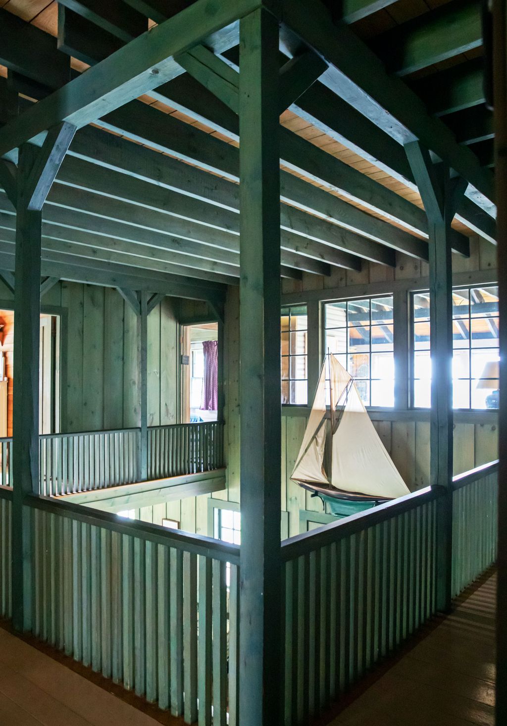 Image may contain Banister Handrail Railing Porch Floor Wood and Flooring