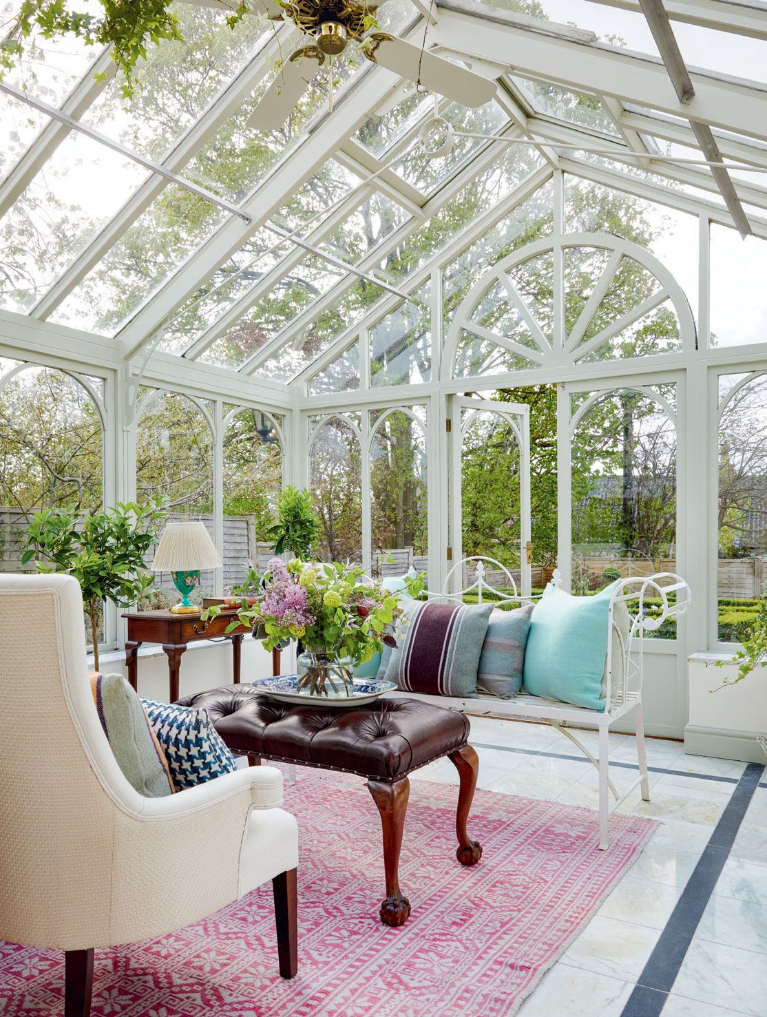 In the conservatory the bench was a gift from Georges mother and the cushions are from Katherine Fraser.