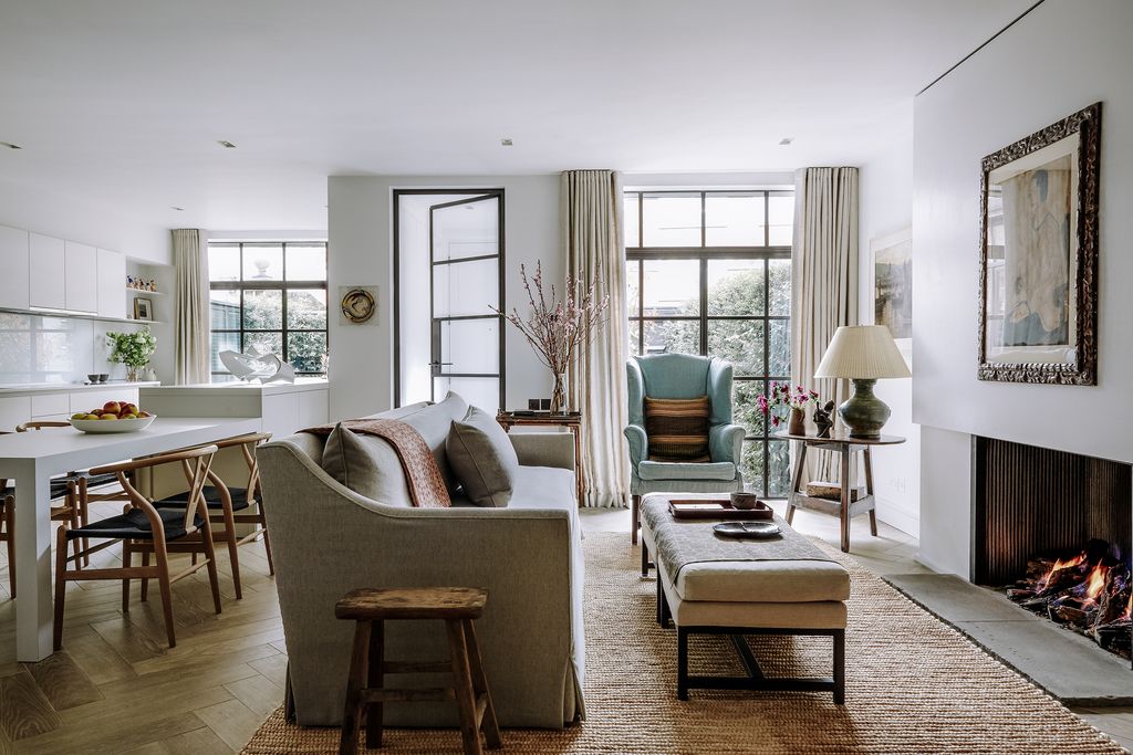 Image may contain Living Room Room Indoors Furniture Couch Interior Design Table Chair and Home Decor