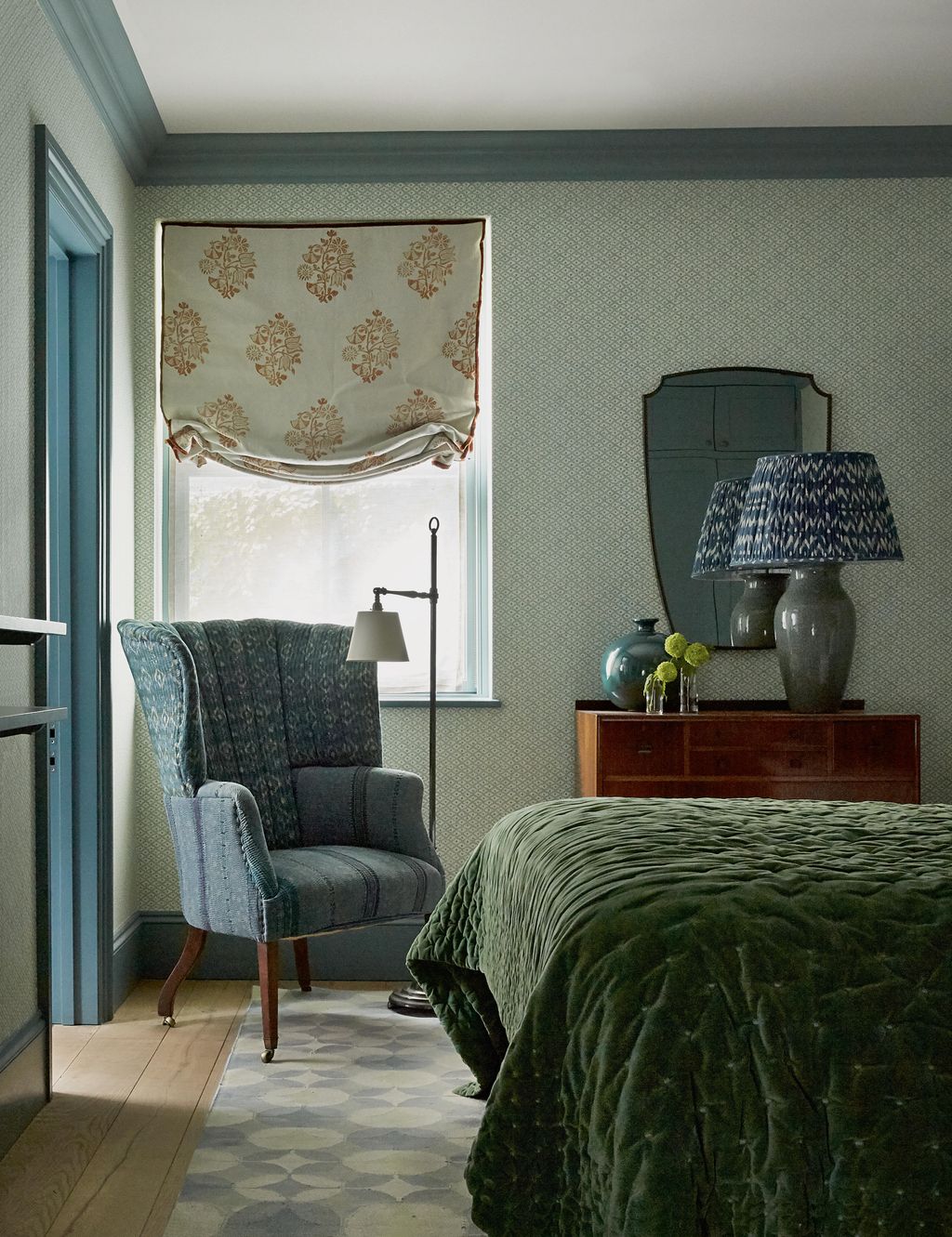 This bedroom features Galbraith  Pauls ‘Lattice wallpaper in baby bluekiwi. The armchair is from Dean Antiques. The...