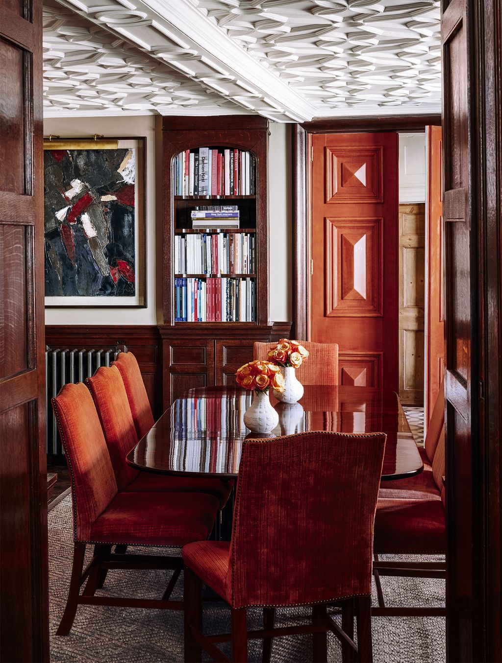 Image may contain Furniture Chair Room Indoors Hardwood Wood Bookcase Dining Room and Flooring