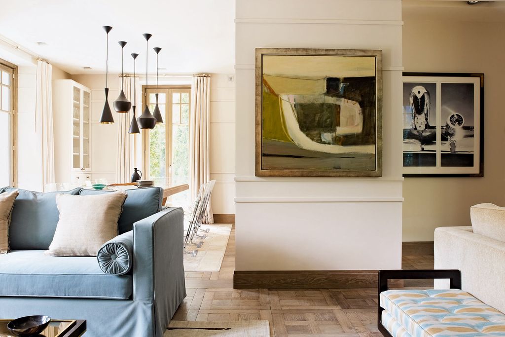 Image may contain Living Room Room Indoors Furniture Interior Design Flooring Home Decor Couch Floor and Wood