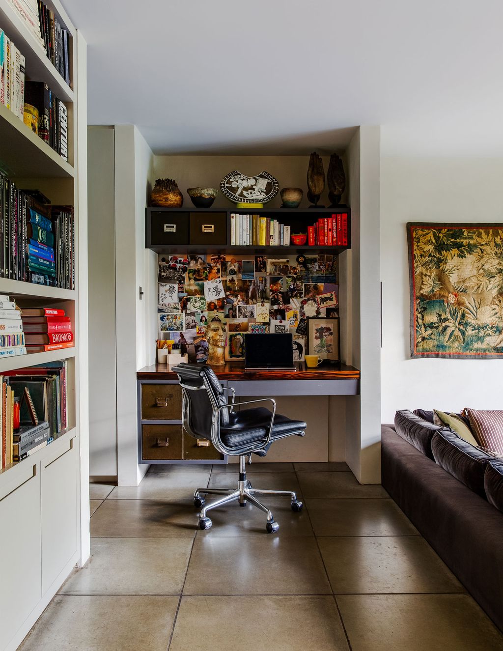 Image may contain Furniture Shelf Living Room Room Indoors Bookcase and Interior Design