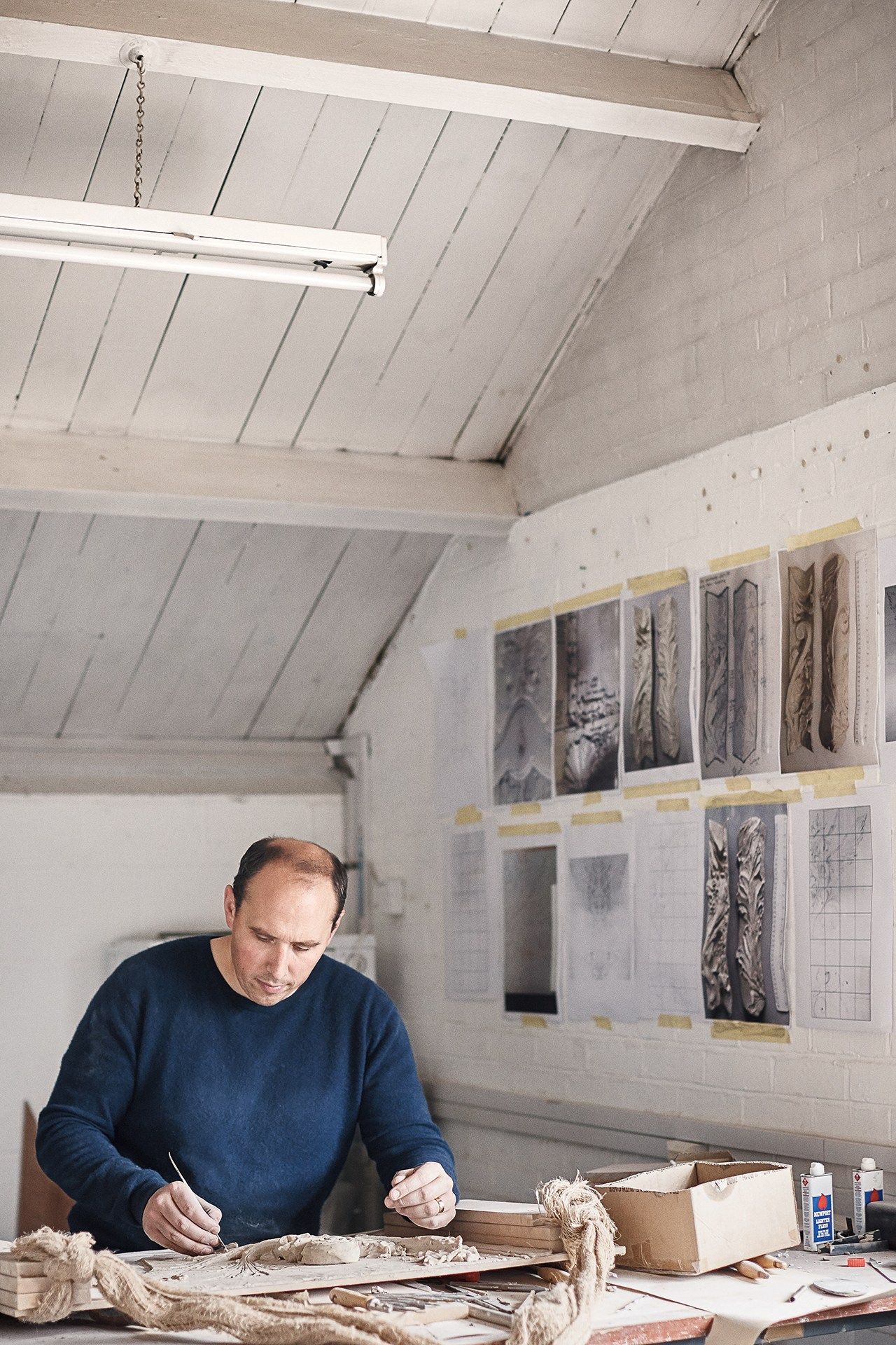 Image may contain Human Person Wood Plywood Housing Building Flooring Clothing Apparel and Home Decor