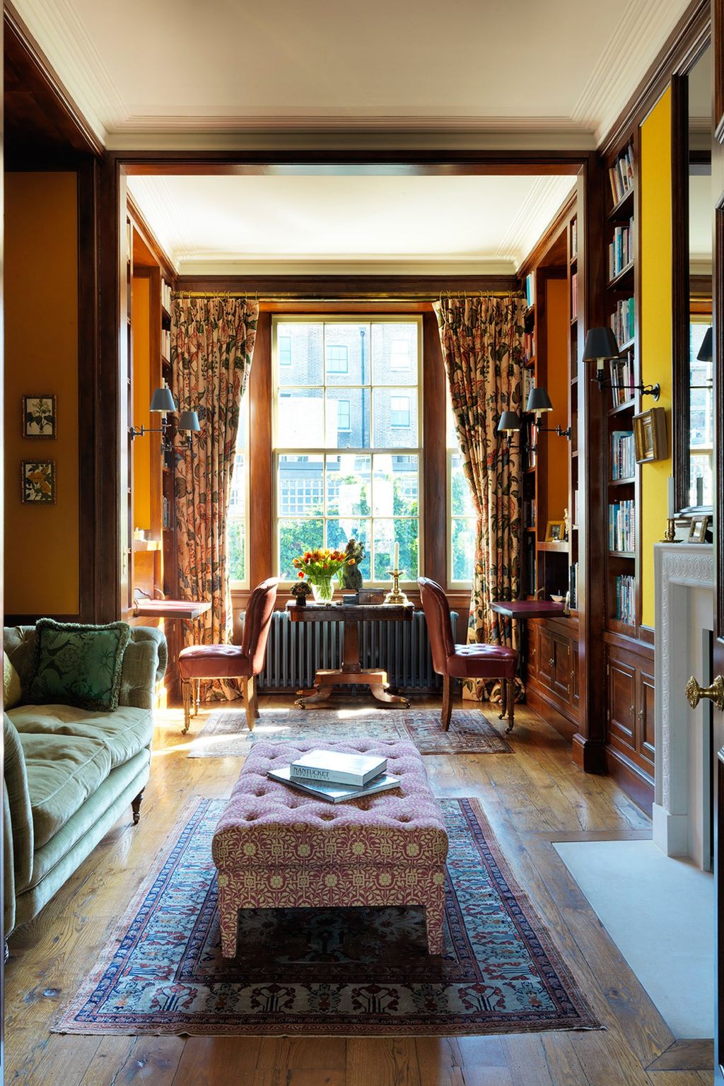 The study has feltcovered walls and a pair of backtoback desks which are incorporated into the woodwork. i