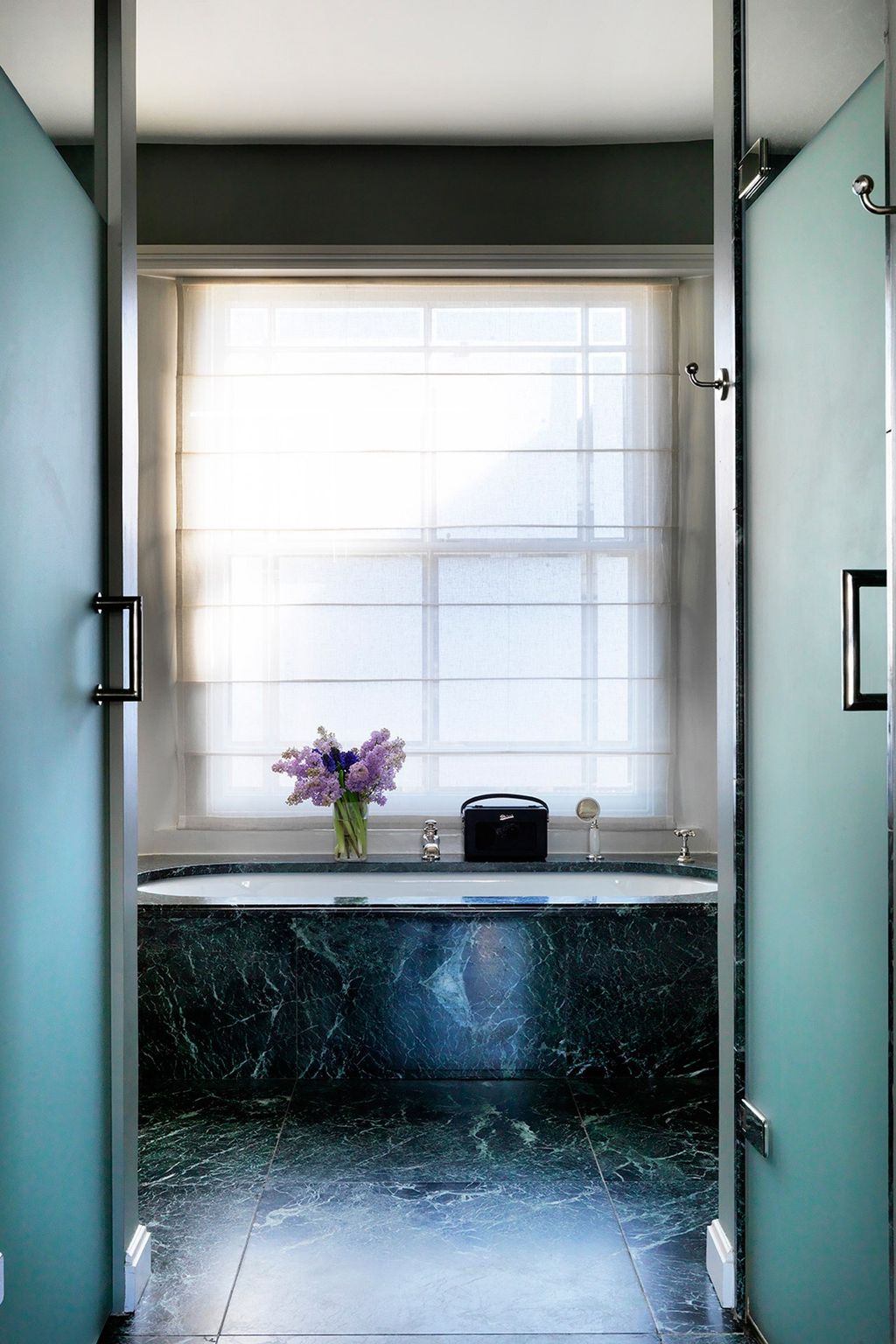 Image may contain Home Decor Interior Design Indoors Furniture Door Flower Plant and Blossom