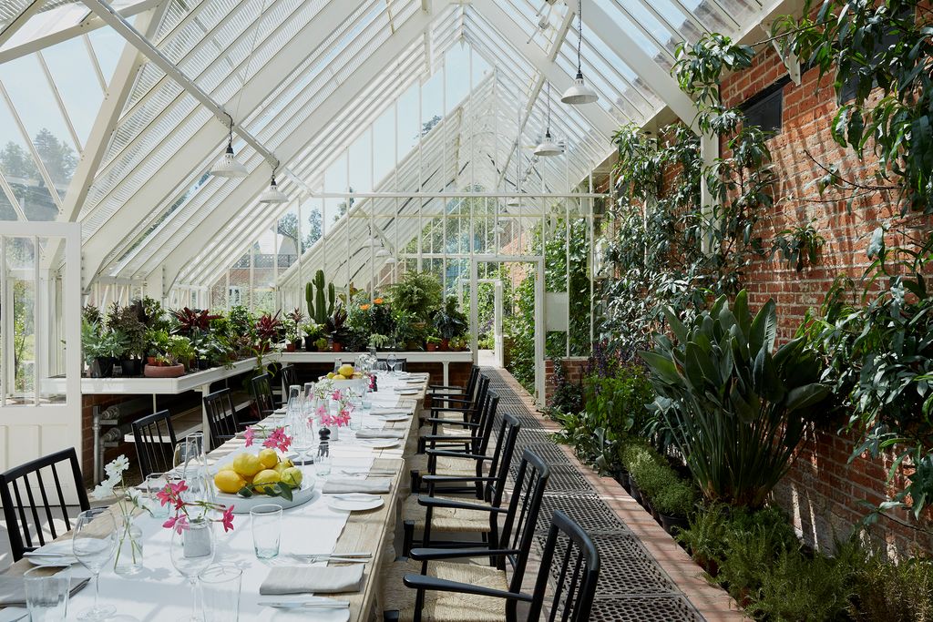 Image may contain Restaurant Home Decor Plant Interior Design Indoors Furniture and Outdoors