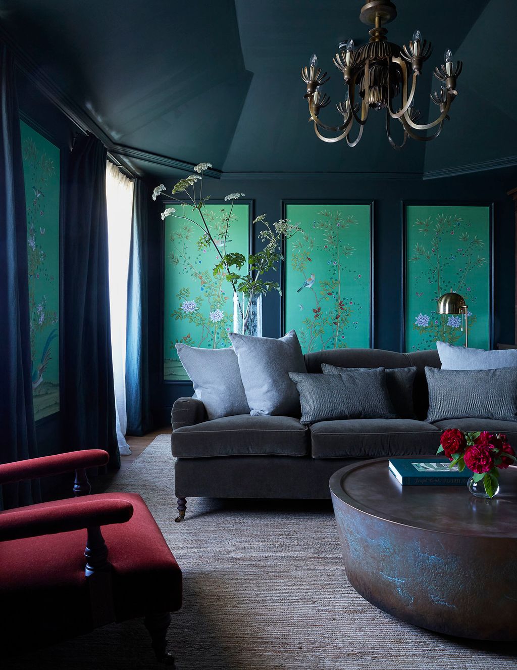 Image may contain Furniture Living Room Indoors Room Couch Interior Design Lamp Chandelier Chair and Table