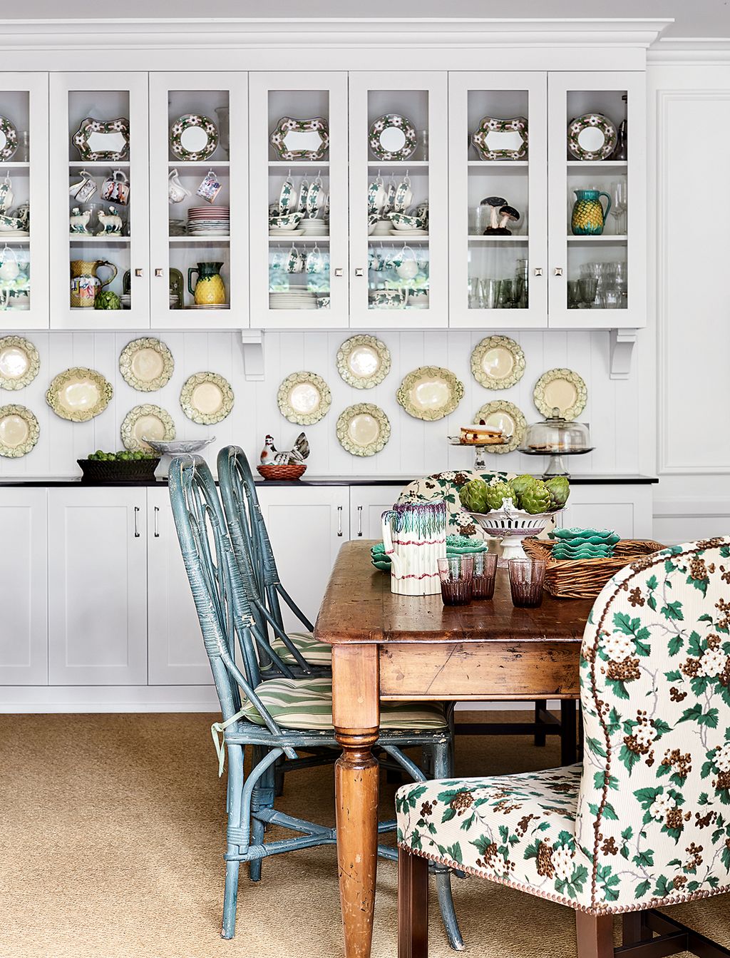 Image may contain Furniture Chair Indoors Room Interior Design Dining Room Cabinet China Cabinet Shelf and Table