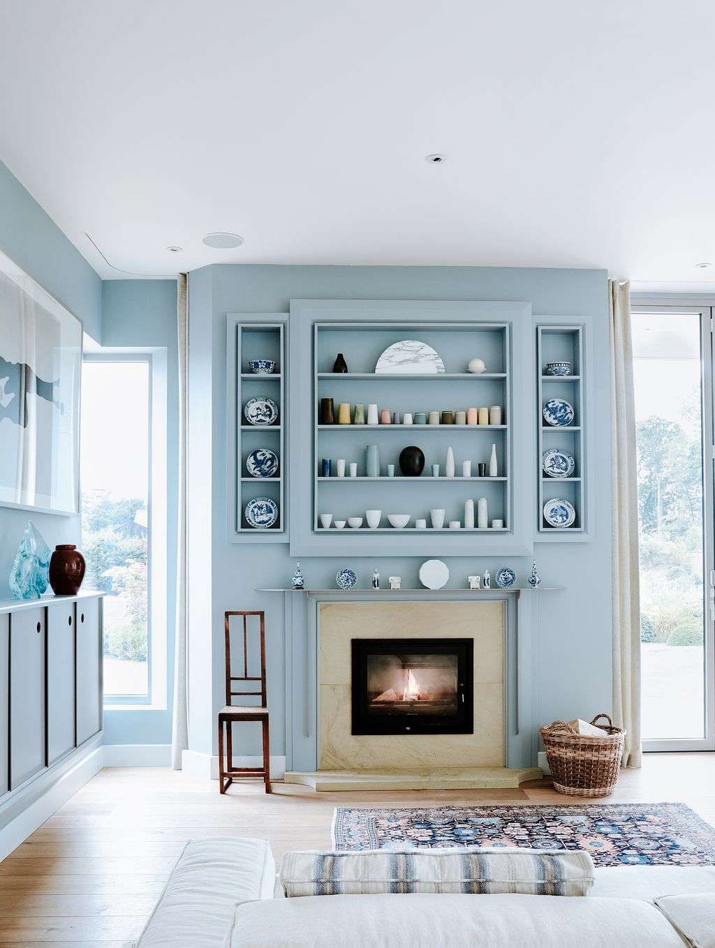 Image may contain Indoors Fireplace Hearth Interior Design Room and Living Room