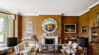 Image may contain Living Room Room Indoors Interior Design Furniture Couch Fireplace and Flooring