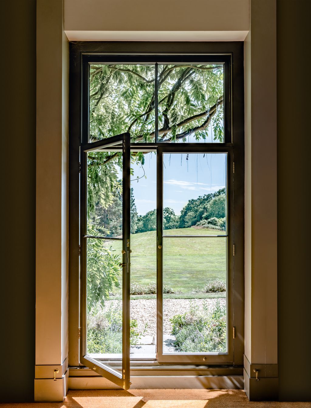 Image may contain Door Picture Window and Window