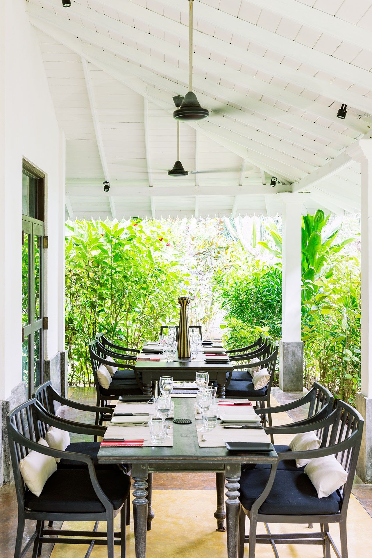 Image may contain Furniture Chair Porch Dining Table Table and Patio