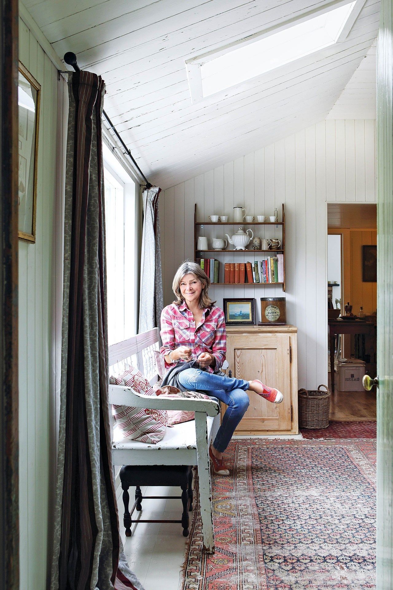 Image may contain Human Person Flooring Furniture Wood Couch Clothing Shoe Footwear Apparel Floor and Living Room