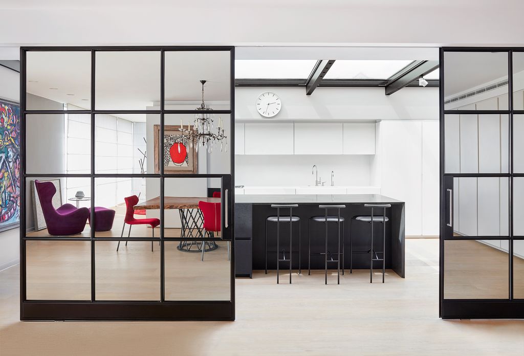 Image may contain Indoors Interior Design Furniture Chair Room Housing Building Tabletop and Door