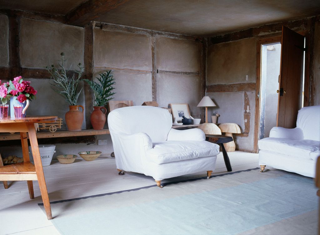 Image may contain Furniture Living Room Room Indoors Couch Interior Design Flooring Rug and Floor