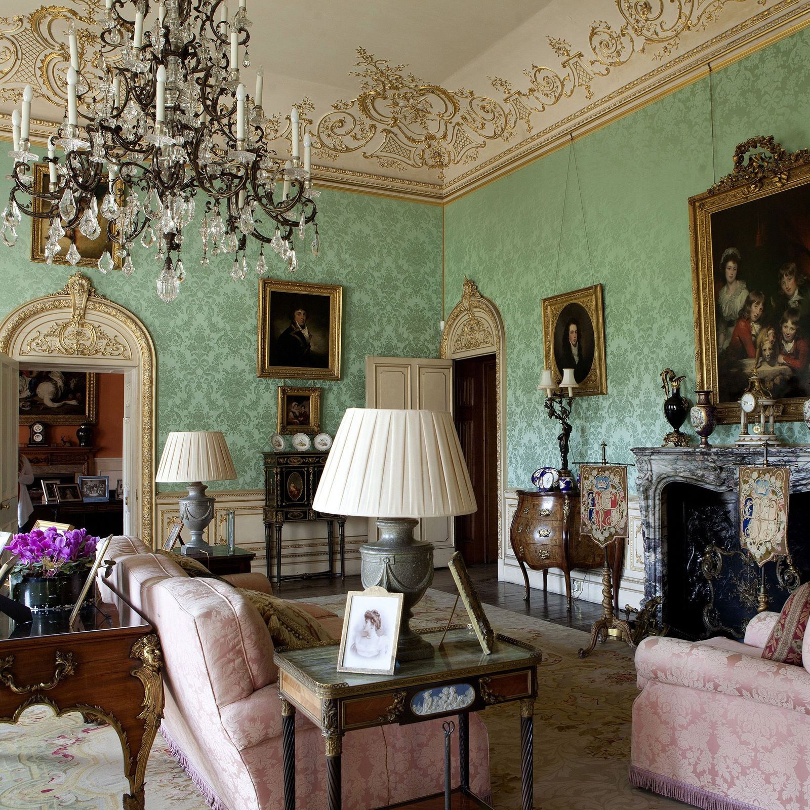 Image may contain Living Room Indoors Room Furniture Lamp Couch Table Lamp Chandelier and Interior Design