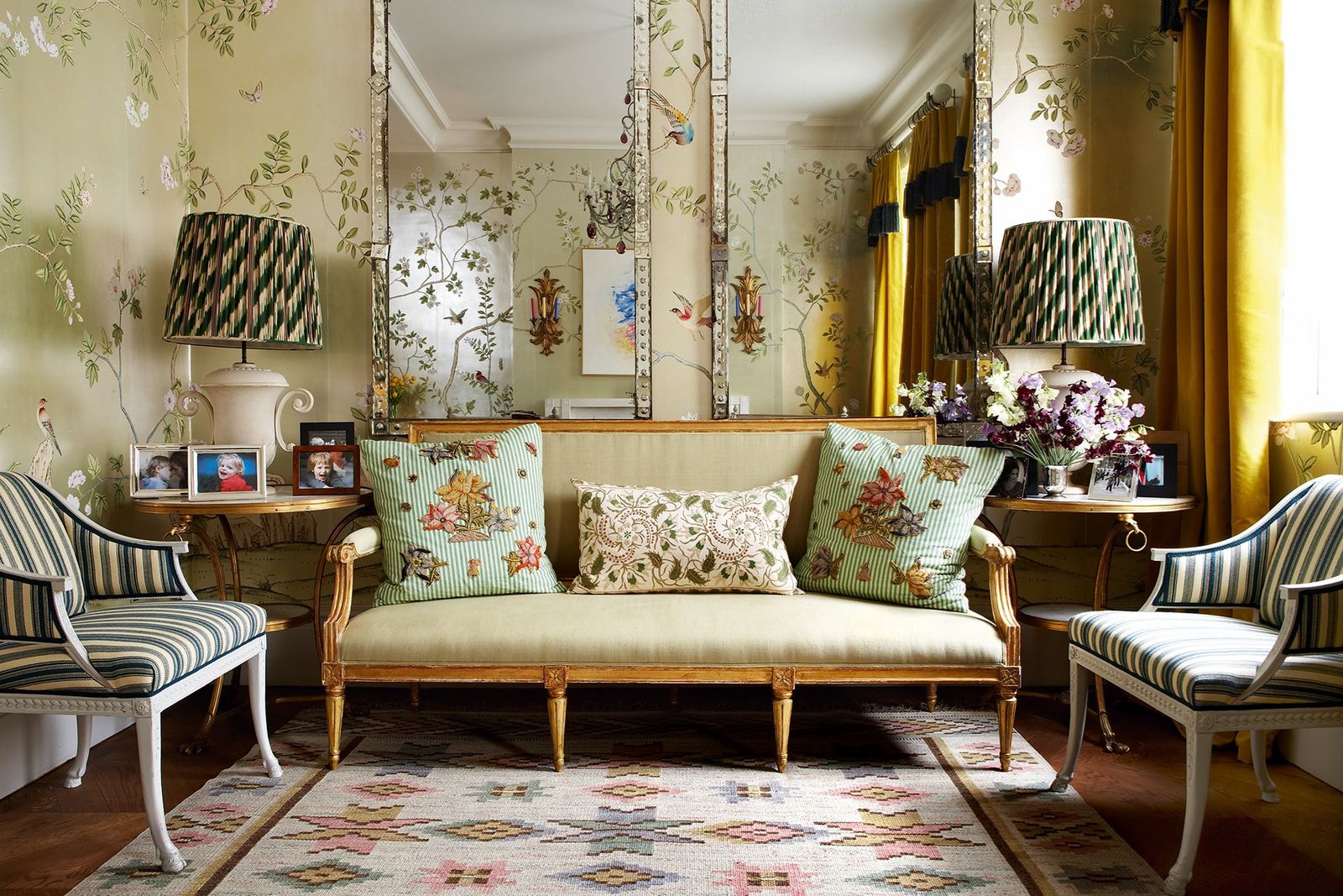 Image may contain Living Room Room Indoors Furniture Couch Cushion Pillow Lamp Table Lamp Rug and Interior Design